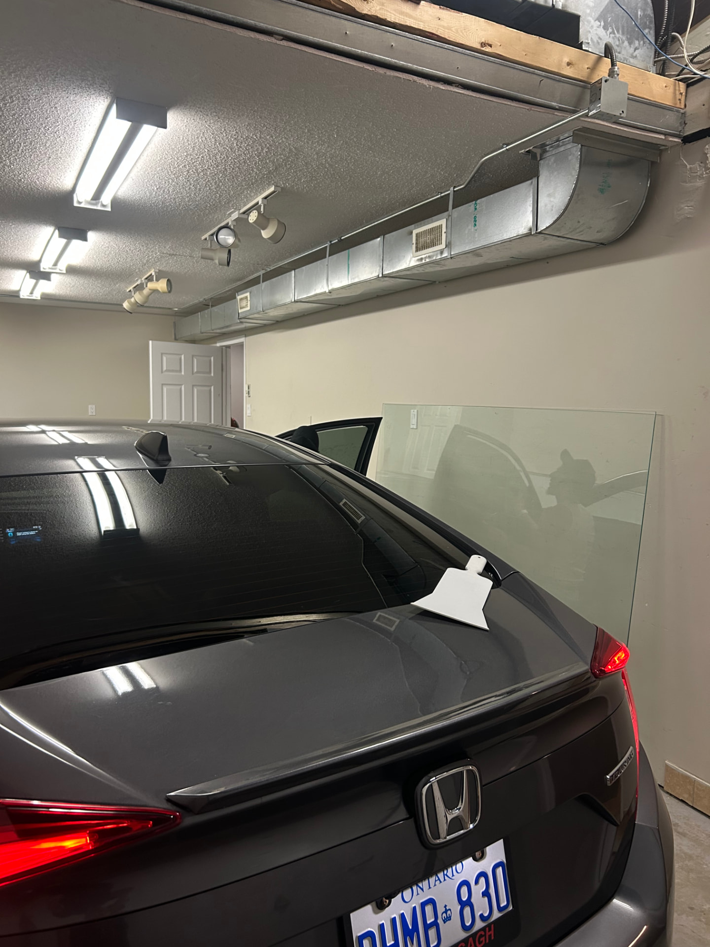 Rear glass tint in progress on a Honda Accord in Ottawa