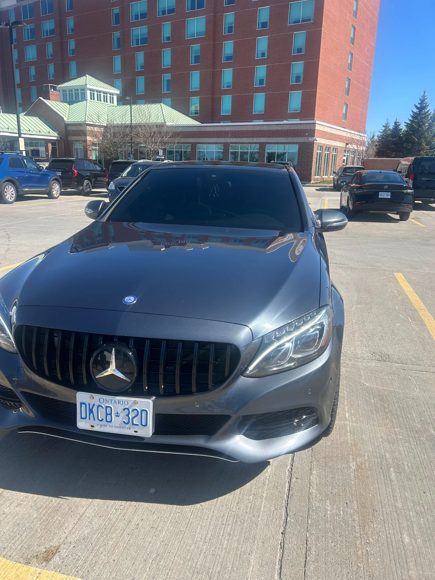 Mercedes-Benz C-Class with custom grille and tint by AutoWa Customs