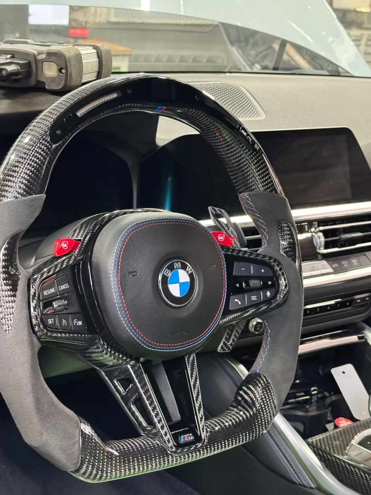 Forged carbon steering wheel on a BMW M in Ottawa