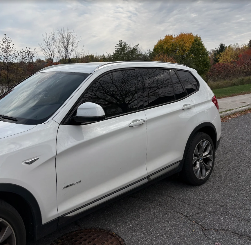 White BMW X3 with ceramic window tint by AutoWa Customs